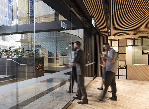MC-125 sliding door operator on a commercial glass entrance