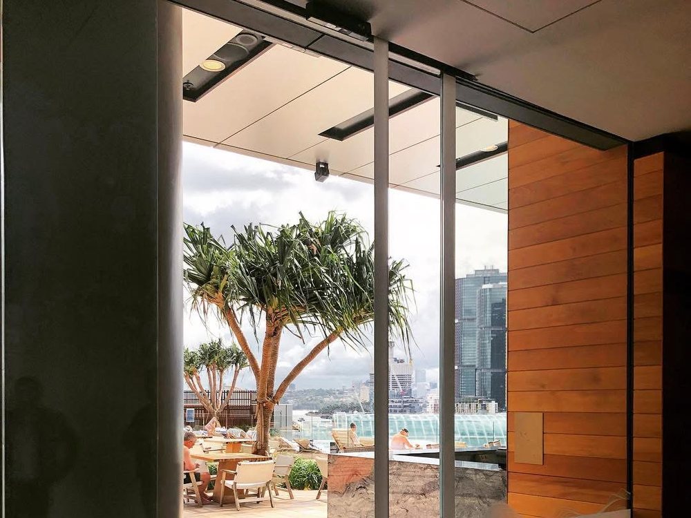 Bi-parting automatic sliding doors in a commercial interior